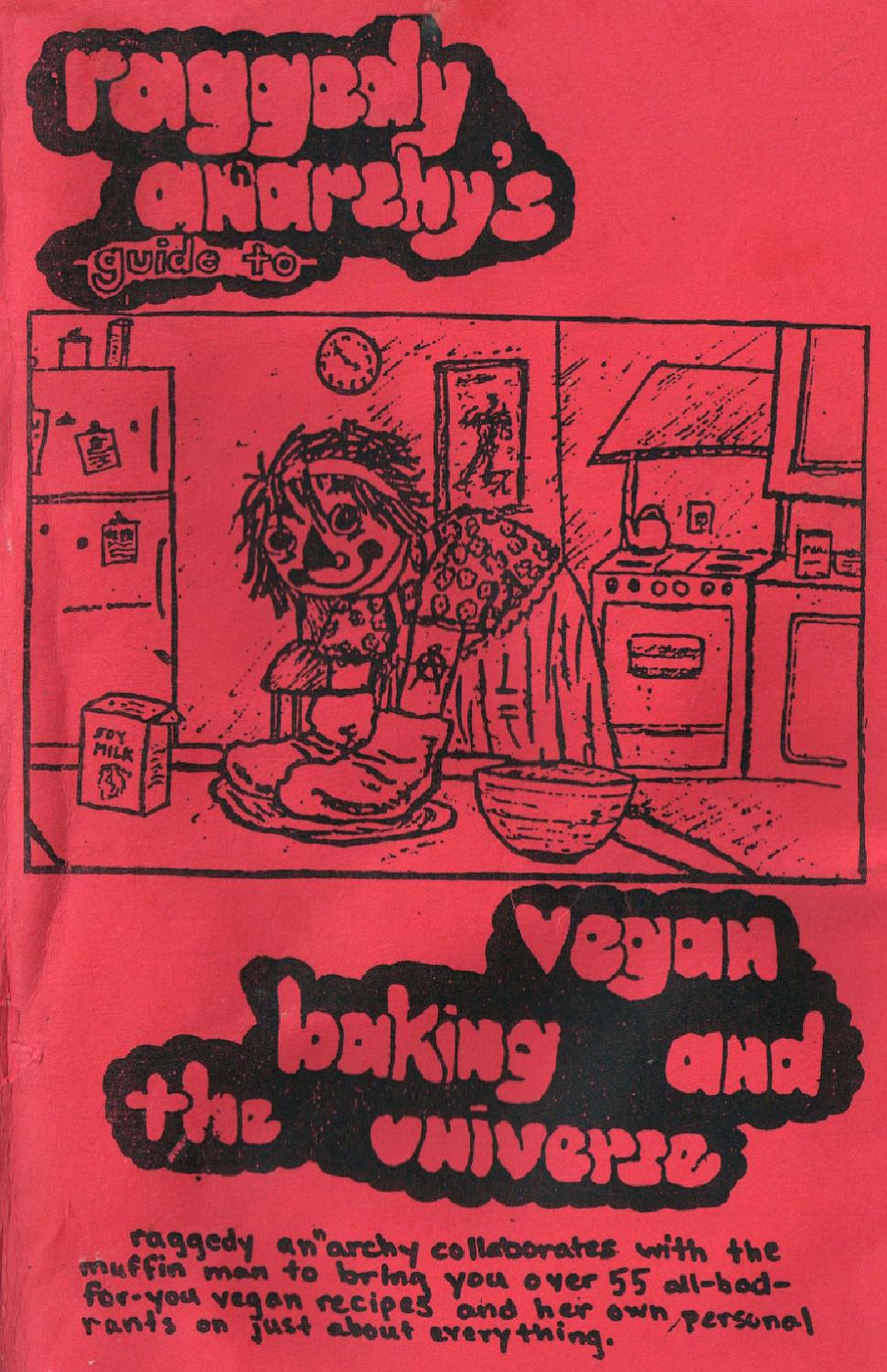 The cover is red card stock, with the title in bubble letters.  There is an illustration of Raggedy Ann in a kitchen, rolling out dough.