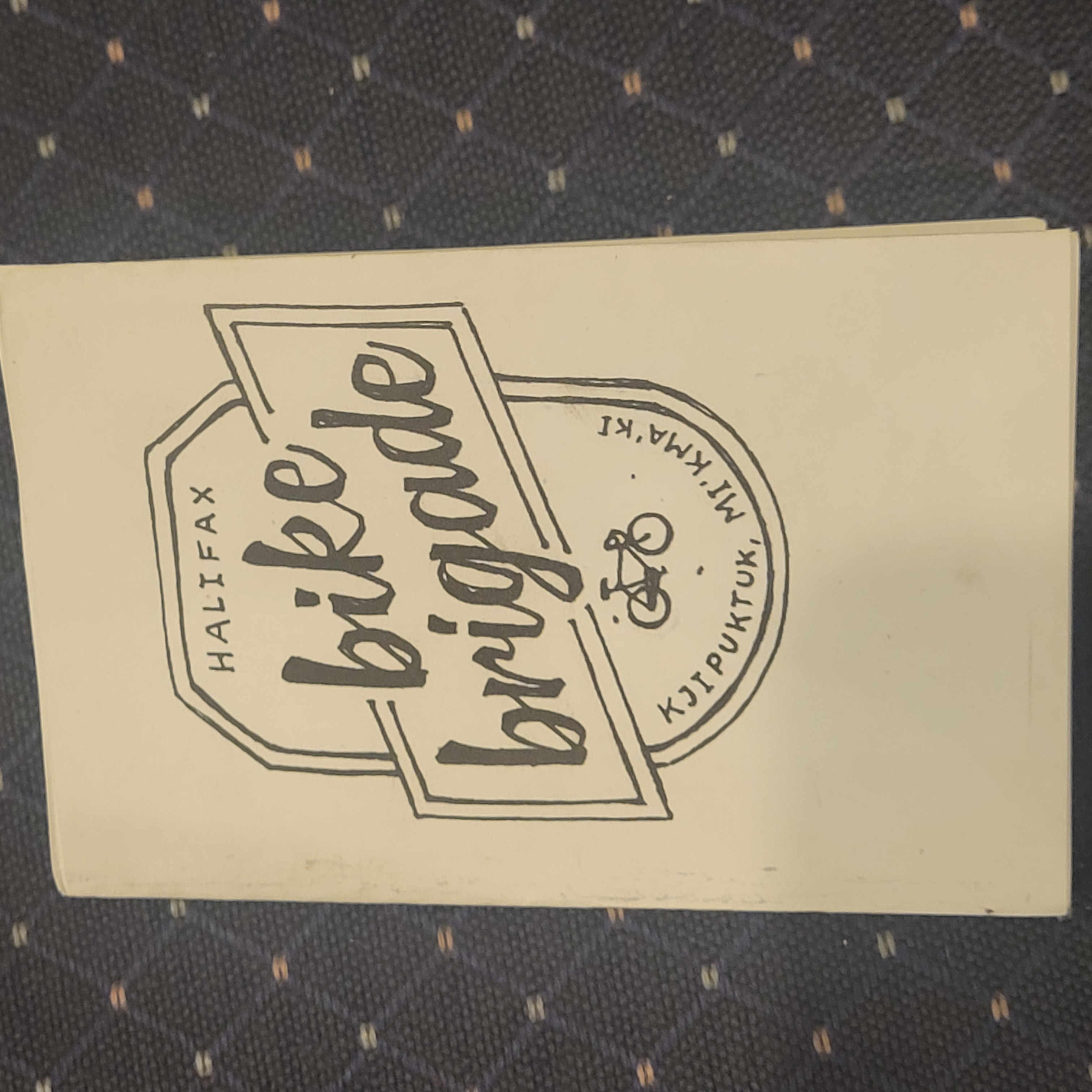 banner with bike brigade title and bicycle black and white
