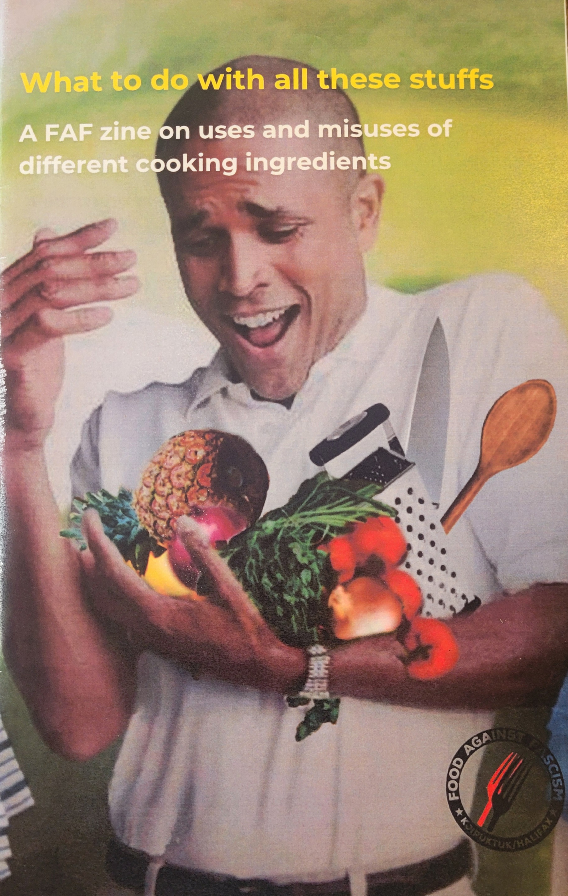Color photograph. Surprised man wearing white button shirt holding a number of ingredients and utensils (pineapple, cheese grater, spoon, knife, greens)