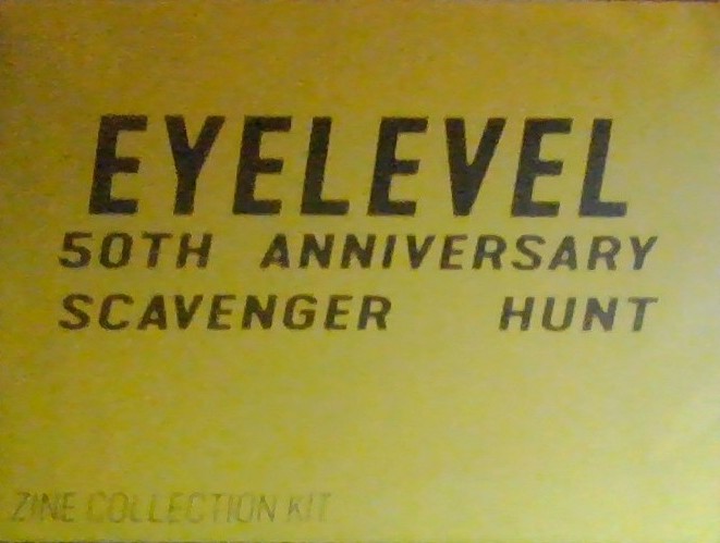Envelope reading: "Eyelevel 50th Anniversary Scavenger Hunt: Zine Collection Kit". Black text on yellow, the word "Eyelevel" is larger and above the rest of the text.