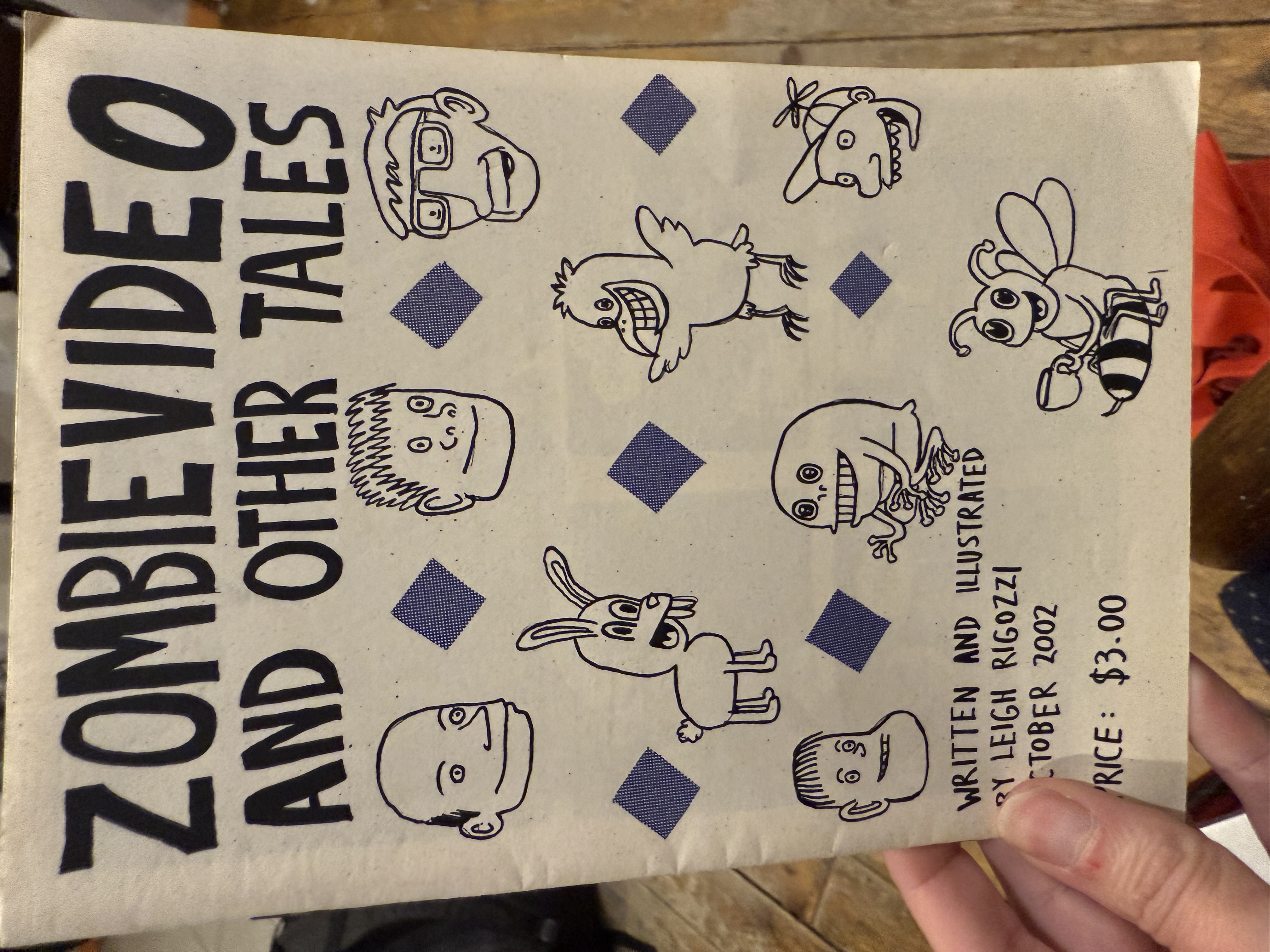 Cover of Zombievideo and Other Tales zine with character illustrations by author
