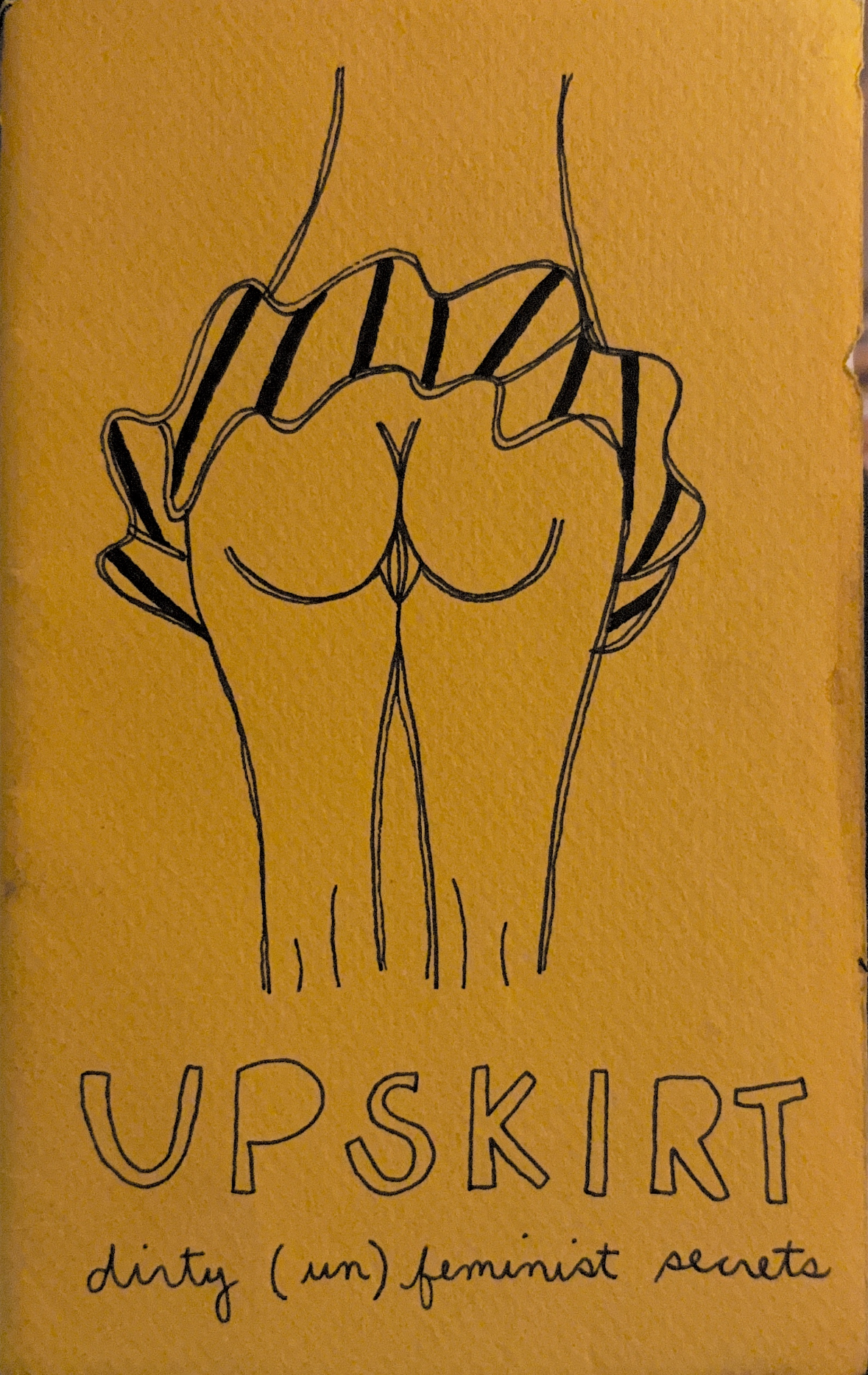 Yellow cover, person with skirt lifted up and exposed